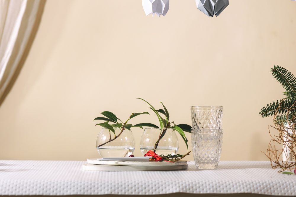 Plates and golden cutlery to mount the festive table, on the table