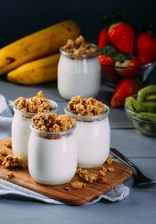 Glass bottles with milk and walnuts