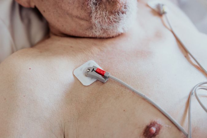 Older man admitted to a hospital room.