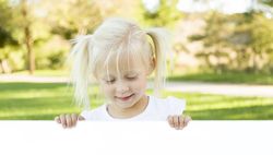 Cute Little Girl Holding White Board with Room For Text