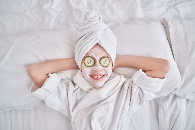 Cheerful kid on spa treatments