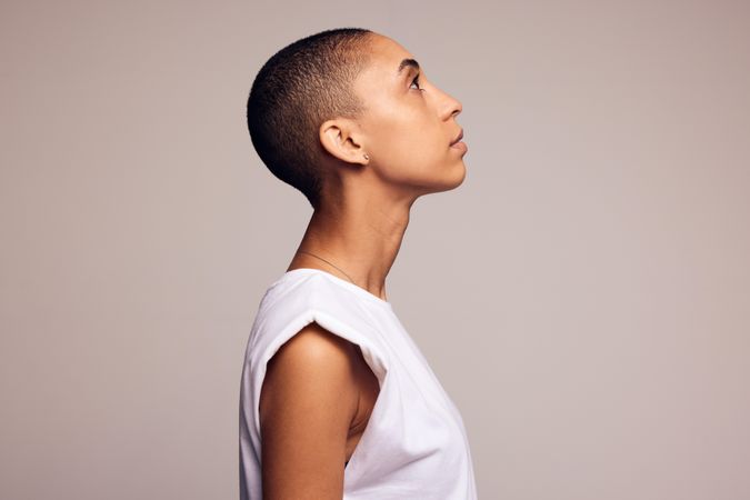 Profile view of a woman with shaved head