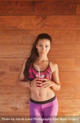 Fitness female model in sportswear with juice after workout 0WzVyb
