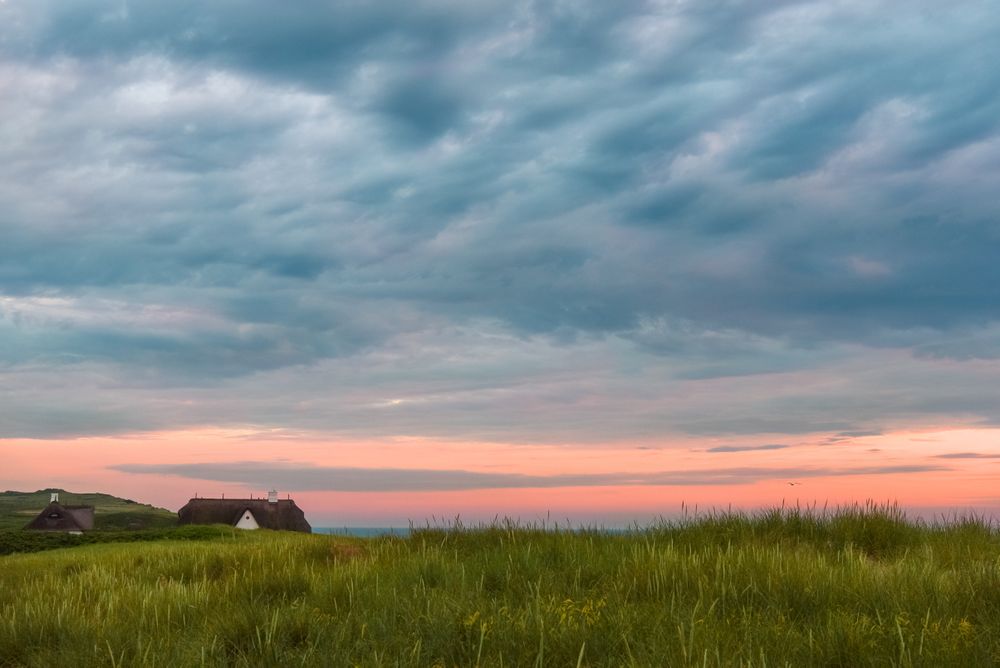 Colorful cloudscape at sunset on Sylt island, in North Sea, Germany