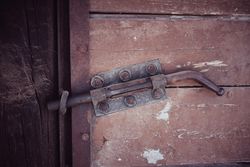 Old door of barn with latch