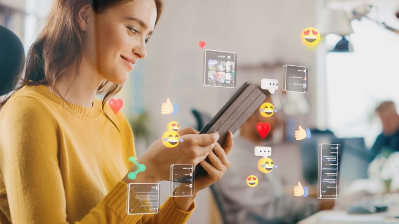 Social Media Visualization Concept: Happy Young Woman Uses Digital Tablet Computer in the Office,  Social Media Posts, Smiley Faces