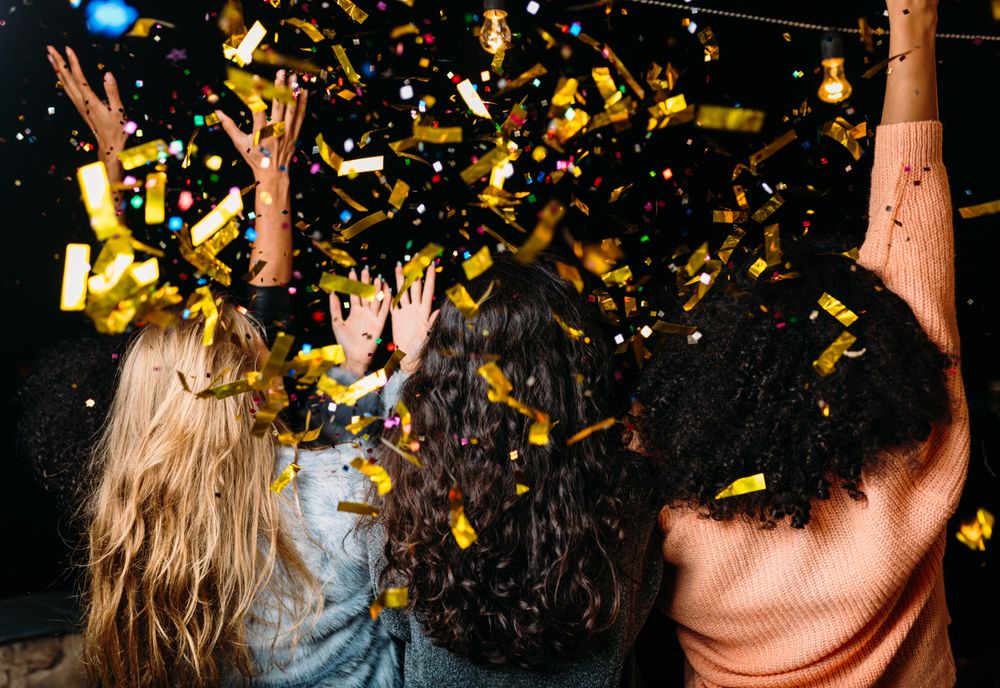Rear view of woman at party with confetti