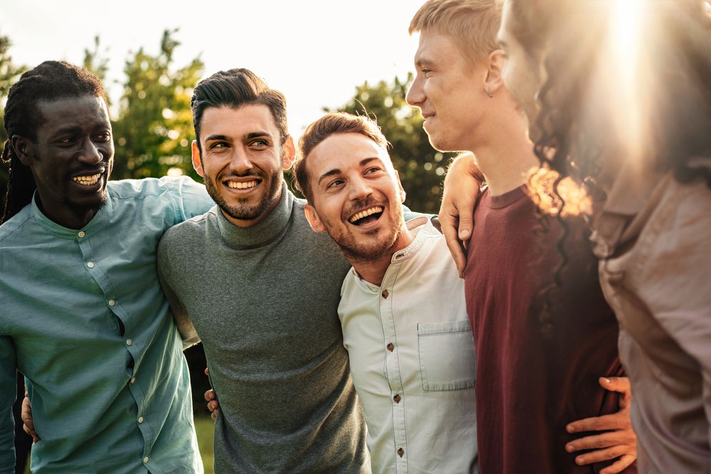 Group of happy men enjoying outdoors