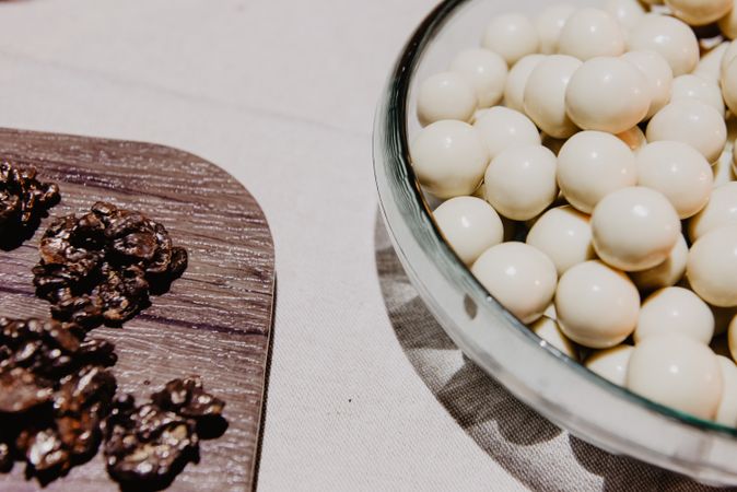 Tasty fresh candies on plate and board