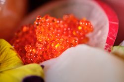 Fresh red roe with slice of radish