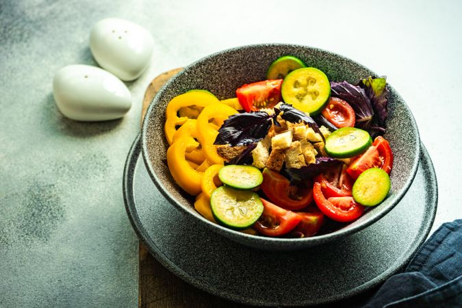 Healthy gourmet vegetarian salad in bowl on counter