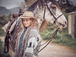 Woman and horse in equine equipment