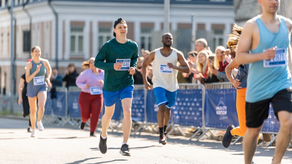 Diverse Race Runners Reaching the Finish Line, Celebrating Their Victory and Achieving their Goal