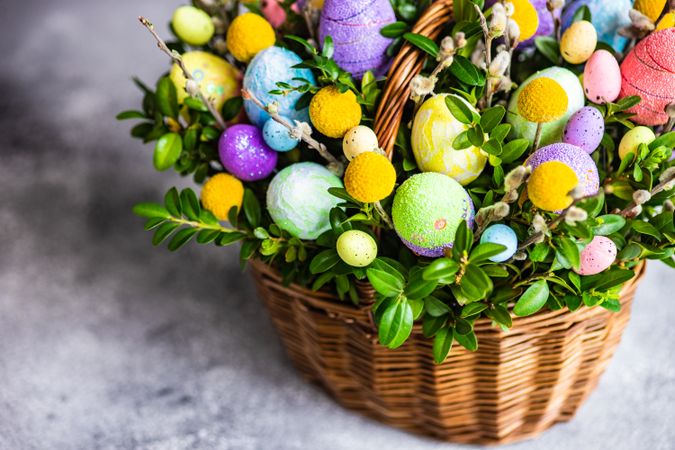 Spring basket with Easter eggs and foliage
