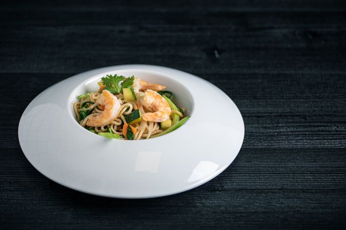 Tasty Pad Thai of vegetables and prawns in plate