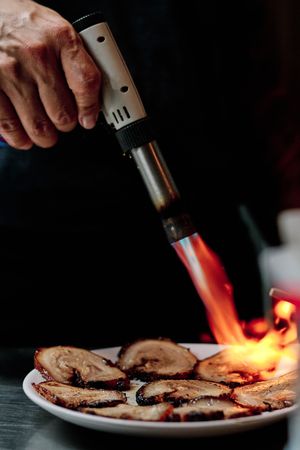 Chef Using Kitchen Blowtorch