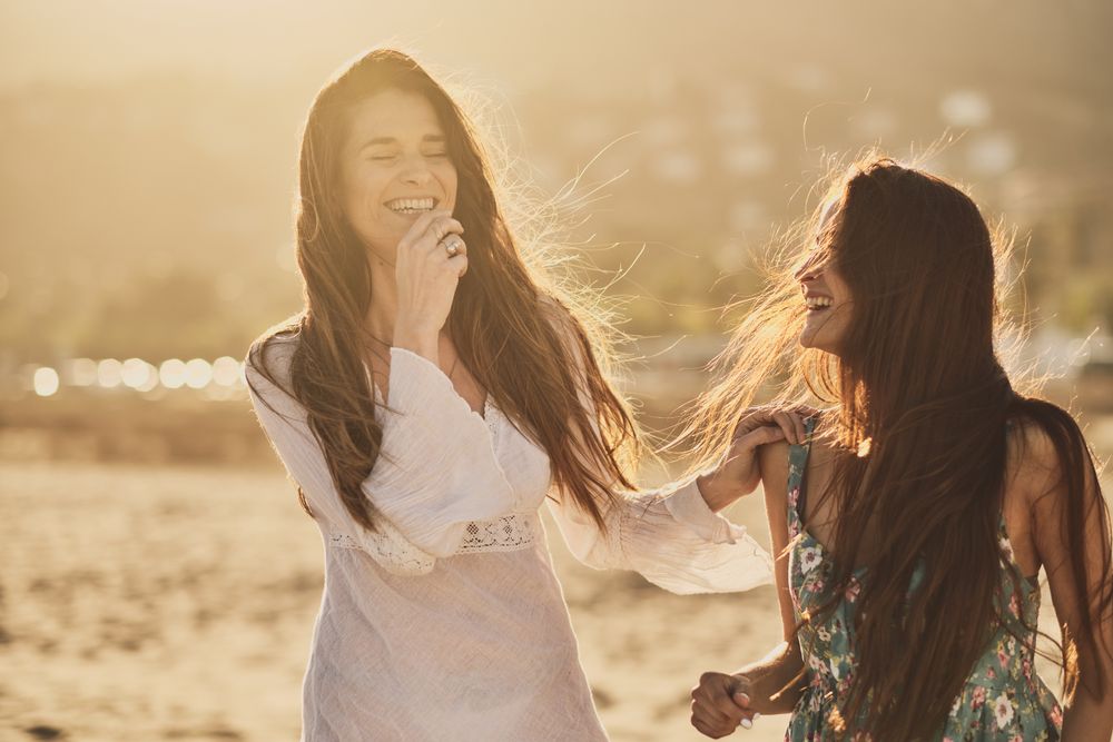 Two happy girls in a summer day at the beach