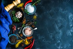 Top view of spices and salt on counter with copy space