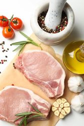 Composition with raw meat and ingredients on light background, top view