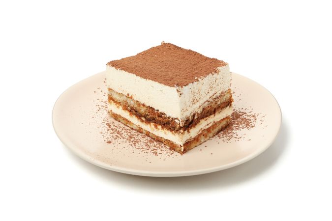 Sweet tiramisu isolated on blank background. Tasty dessert