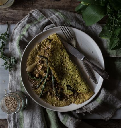 Served vegetarian crepe with oats and asparagus