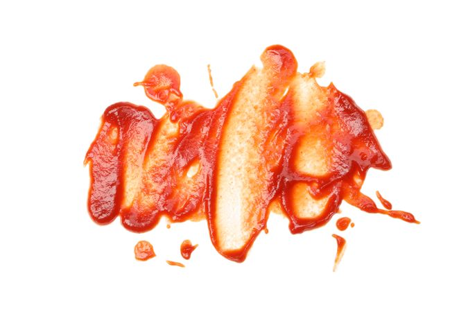 Red sauce isolated on blank background, close up