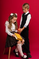 Schoolchildren in uniform with book