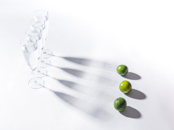 Creative composition of citrus and glasses of water