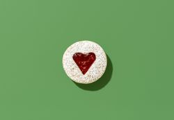 Linzer cookie top view on a green table