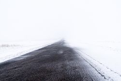 Snowdrift covered road