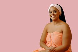 Portrait of happy woman with her hair back in spa headband, copy space