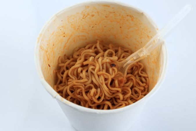 Close Up Spicy Instant Fried Noodle in a Cup