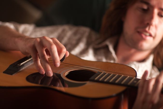 Young Musician Plays His Acoustic Guitar