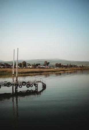 Weathered pier near calm water