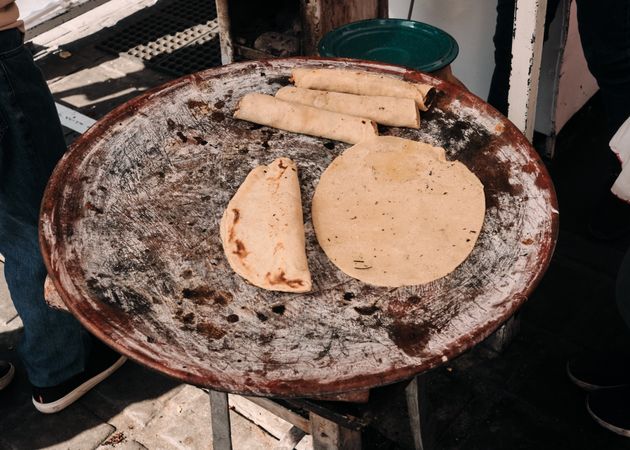 Tortillas heated on ceramic griddle