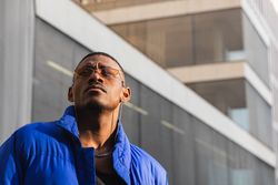 Stylish Black man in sunglasses on street