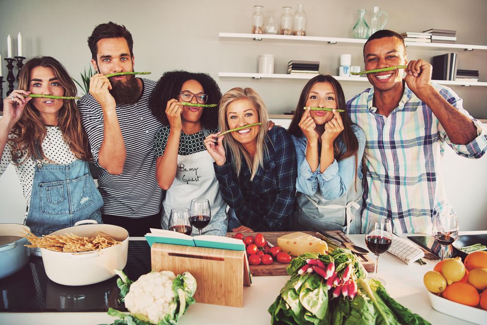 Group of friends making a funny face with asparagus