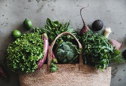 Jute bag with fresh produce, top view, horizontal composition, copy space