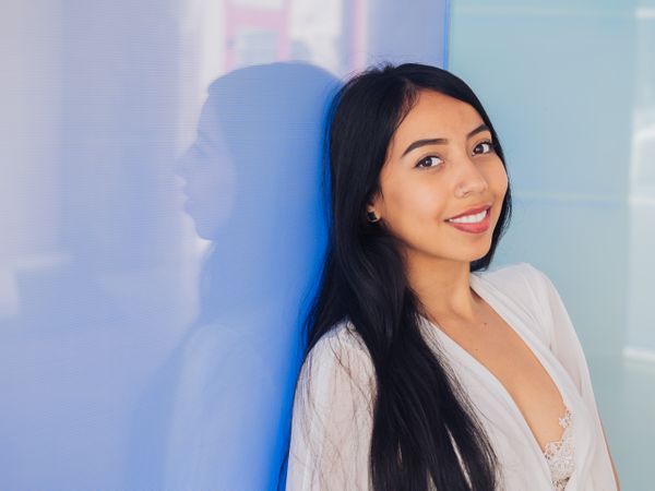 Young woman in beautiful dress smiling