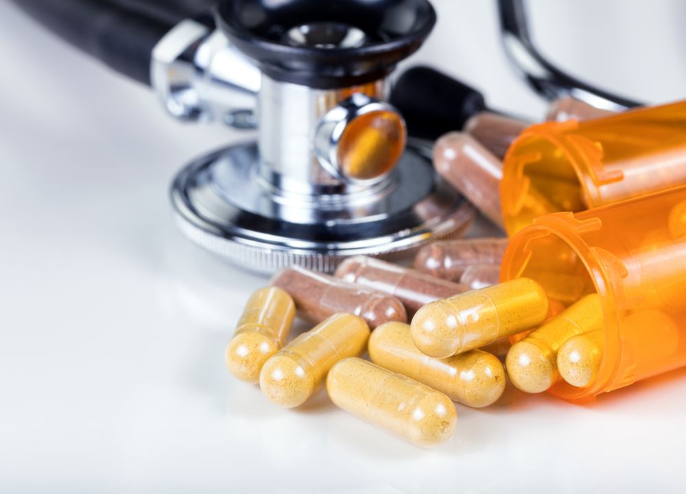 Bottles with capsules and stethoscope