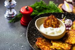 Traditional Ukrainian dish deruny with dipping sauce