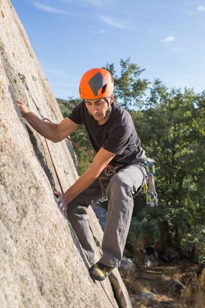 Man climbing a rock