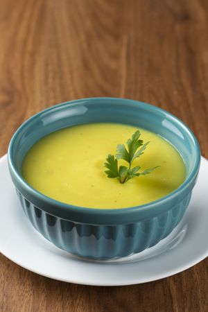 Bowl with onion soup and croutons on the table.