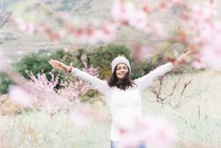 Happy woman in spring countryside