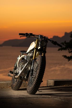 Motorbike near sea during sunset