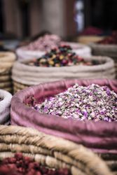 Baskets with dried spices on marketplace