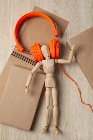 Concept of audiobook with books and headphones, top view