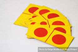 Red and yellow domino cards spread on table 4BaPZx
