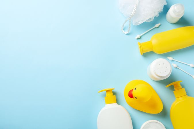 Baby hygiene accessories on blue background, top view and space for text