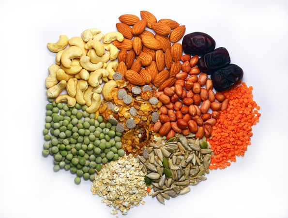 Dried fruits and nuts & fresh fruits on light background.